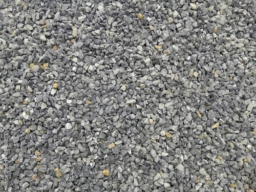 Crushed stone of limestone gravel texture and background.
