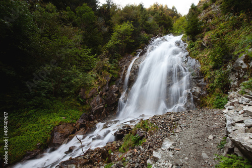 Wanderung zum beeindruckenden Wasserfall in den Südtiroler Alpen - der Egger Wasserfall im Antholzer Tal in Südtirol photo