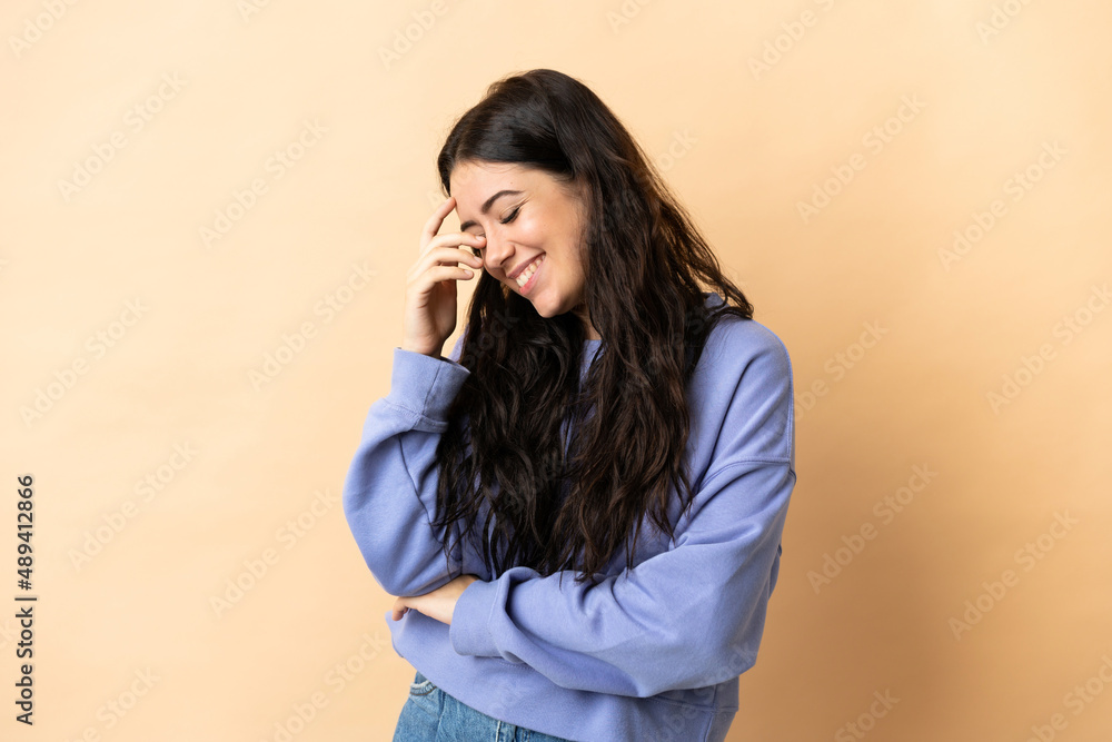 Young caucasian woman over isolated background laughing Young caucasian woman over isolated background laughing