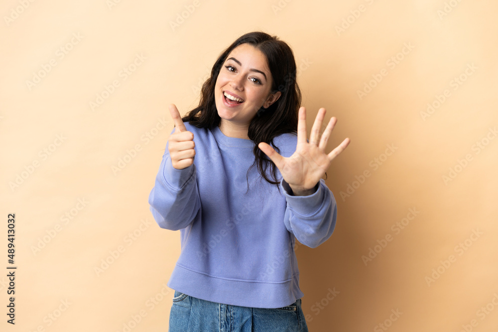 Young caucasian woman over isolated background counting six with fingers Young caucasian woman over isolated background counting six with fingers