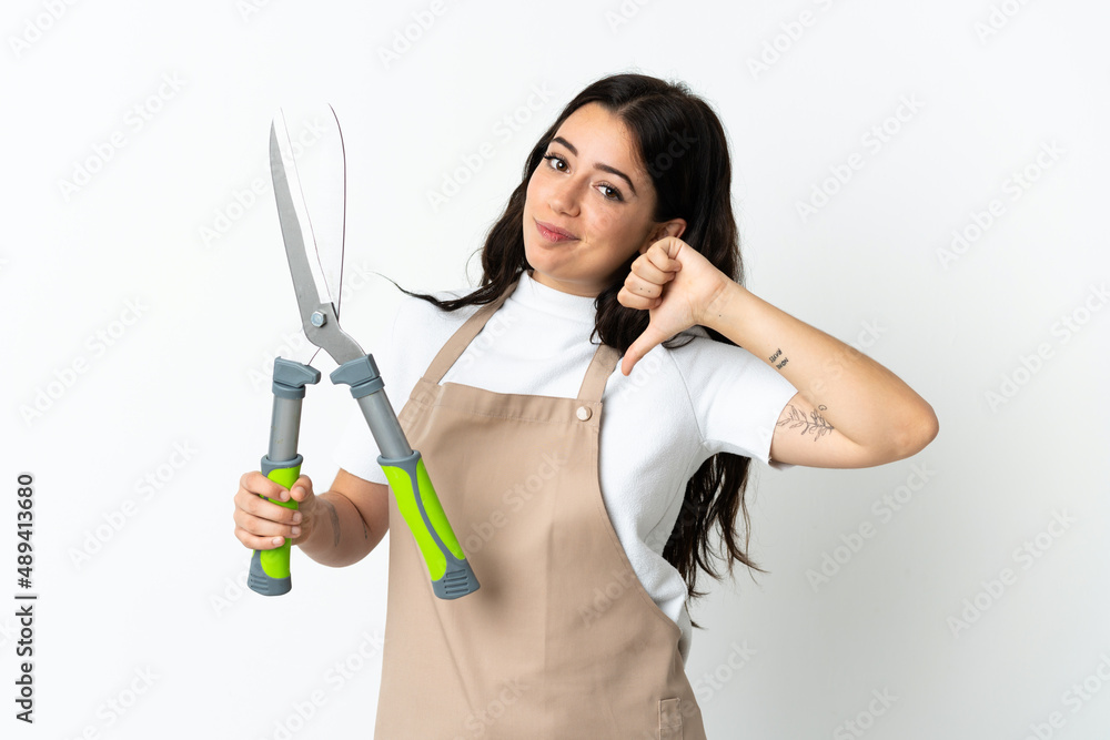 Young caucasian woman holding a plant isolated on white background proud and self-satisfied Young caucasian woman holding a plant isolated on white background proud and self-satisfied