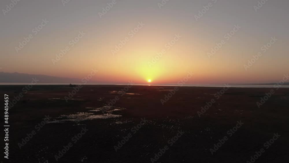 Aerial view of gold sunset sky with evening sky clouds over the sea Aerial view of gold sunset sky with evening sky clouds over the sea