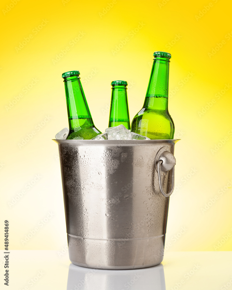 Beer bottles in ice bucket Beer bottles in ice bucket