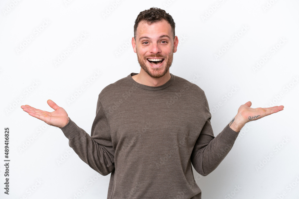 Young Brazilian man isolated on white background with shocked facial expression Young Brazilian man isolated on white background with shocked facial expression