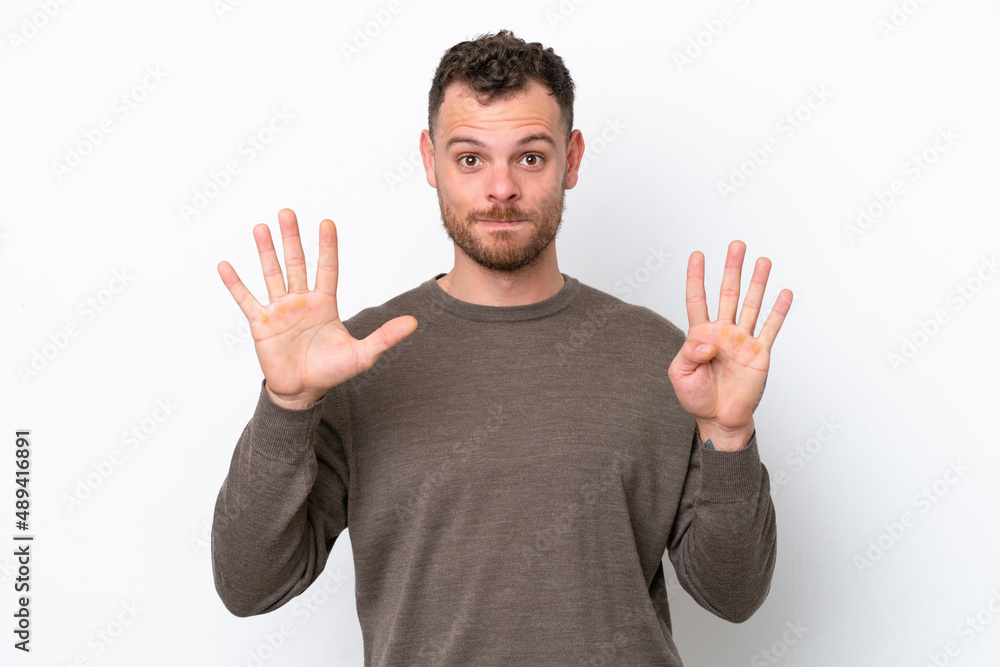 Young Brazilian man isolated on white background counting nine with fingers Young Brazilian man isolated on white background counting nine with fingers