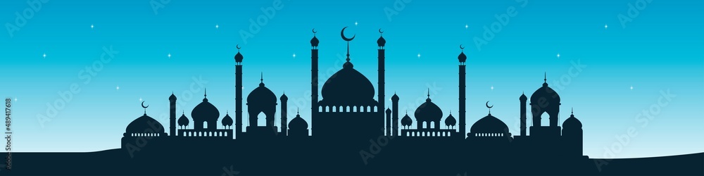 Mosque building on a background of blue sky with stars. Banner for Islamic holiday. 