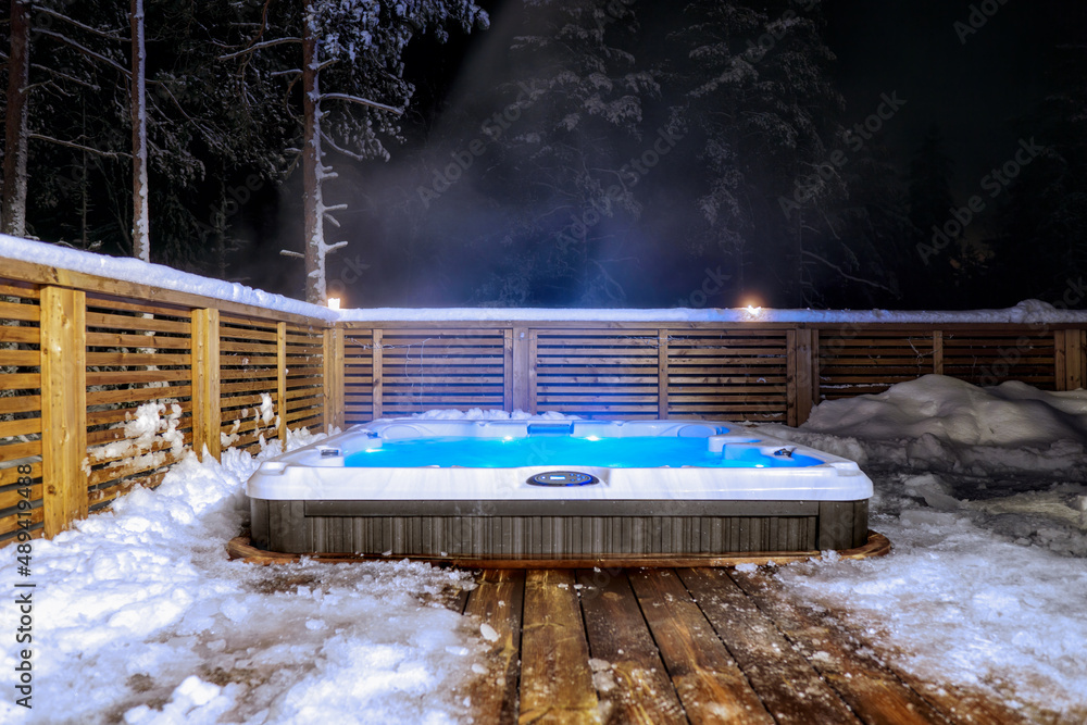 The warm hot tub invites you to relax in the beautiful winter landscape  under the stars. Photos | Adobe Stock