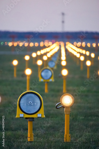 Headlights of runway lights at the airport on the background of the evening sky