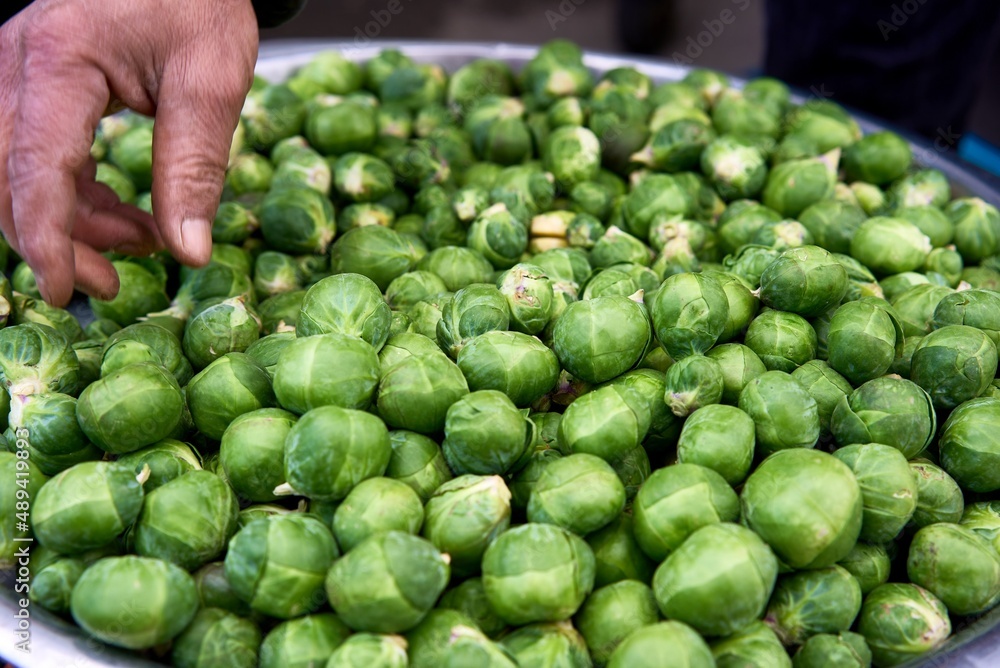 Fresh brussels sprouts in an enameled bowl, view from above. High quality photo Fresh brussels sprouts in an enameled bowl, view from above. High quality photo