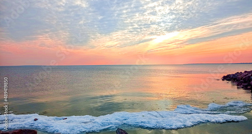 Sunset sky over sea in the evening with colorful clouds