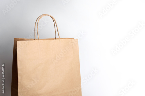 package. craft paper bag on gray background