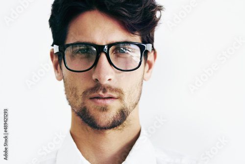 Seeing clearly. Cropped portrait of a handsome male sporting black rimmed glasses next to copyspace.