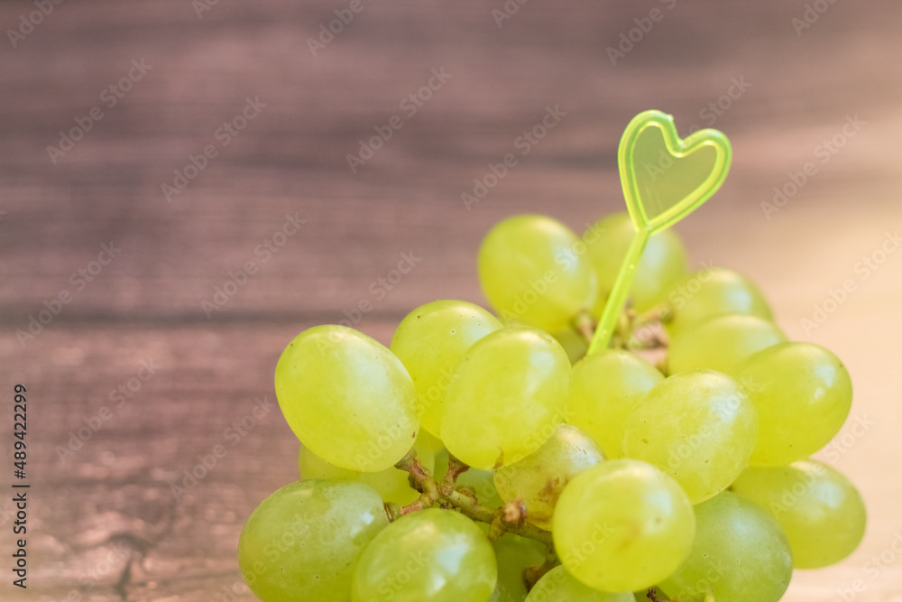 bunch of grapes on wooden background bunch of grapes on wooden background