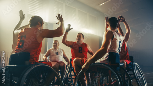 Wheelchair Basketball Game Court Winning Team Celebrate Victory, Cheer and High Five. Players Compete, Shoot, Score Goal Points. Determination, Skill of People with Disability.  photo
