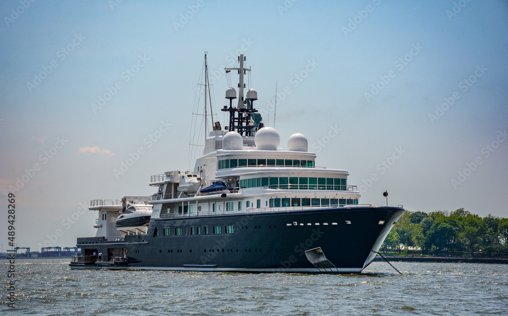 Superyacht in New York Harbor with Statue of Liberty in the background