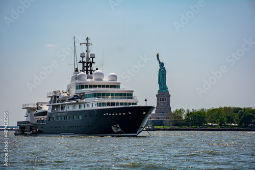 Superyacht and Statue of Liberty New York Harbor