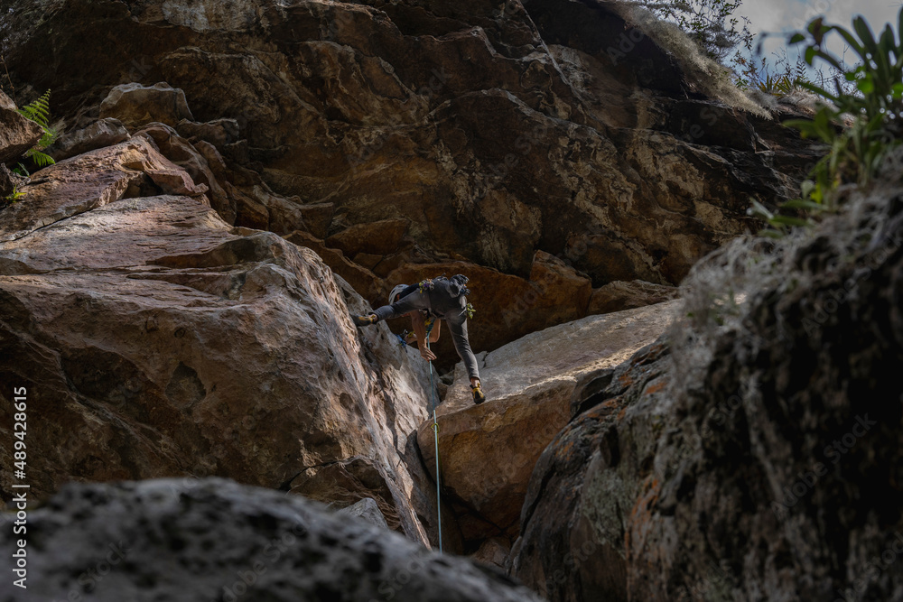 Rock Climber climbing the route Para mis amigos in Suesca Colombia Rock Climber climbing the route Para mis amigos in Suesca Colombia