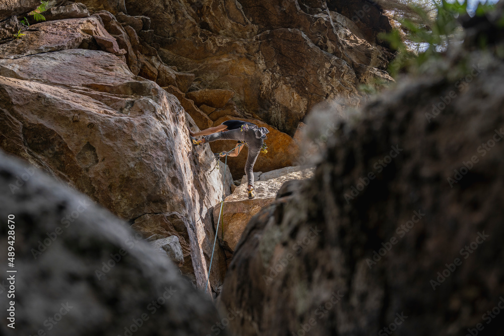 Rock Climber climbing the route Para mis amigos in Suesca Colombia Rock Climber climbing the route Para mis amigos in Suesca Colombia