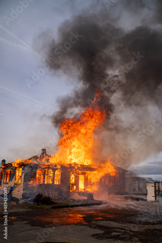 A two-story house fully engulfed structure fire