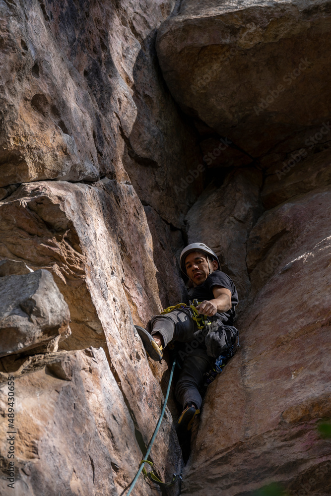 Rock Climber climbing the route Para mis amigos in Suesca Colombia Rock Climber climbing the route Para mis amigos in Suesca Colombia