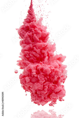 Its an explosion of color. Studio shot of pink ink in water against a white background.