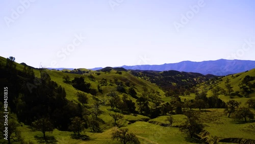 A collection of drone shots revealing incredible natural California landscapes, featuring vast lush views of green rolling hills, oak trees, and beautiful ranch land.