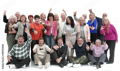 Group of happy elderly people standing and sitting isolated over a white background