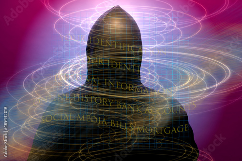 Swirls of light with personal information encircle a hacker on the dark web