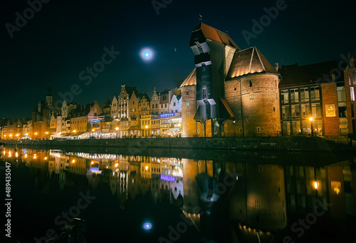 view of the waterfront of Gdańsk at night 