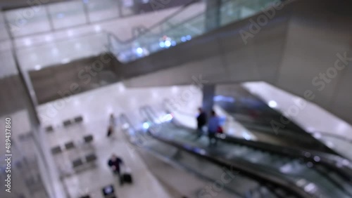 Wallpaper Mural Defocused footage of people using escalator in airport Torontodigital.ca