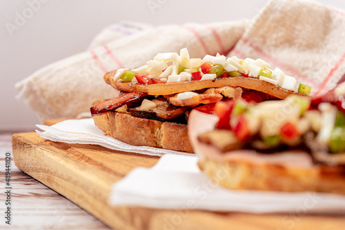 Two Typical Spanish tapas made with a brusqueta and different toppings on each one. traditional spanish cuisine photo