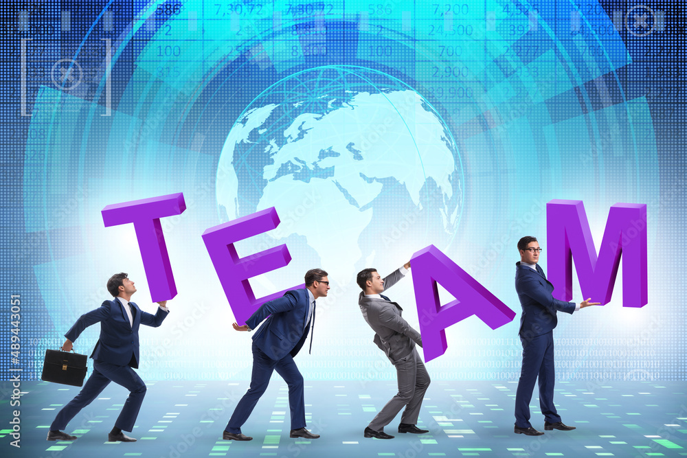 Teamwork concept with people carrying team letters Teamwork concept with people carrying team letters