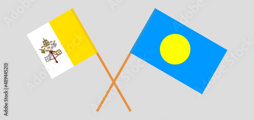 Crossed flags of Vatican and Palau. Official colors. Correct proportion