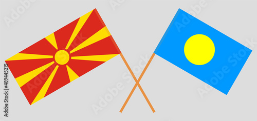 Crossed flags of North Macedonia and Palau. Official colors. Correct proportion