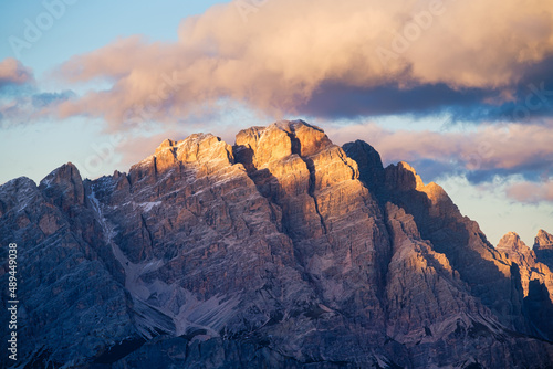 High cliffs during sunset. Dolomite Alps, Italy. Mountains and clear skies. V...