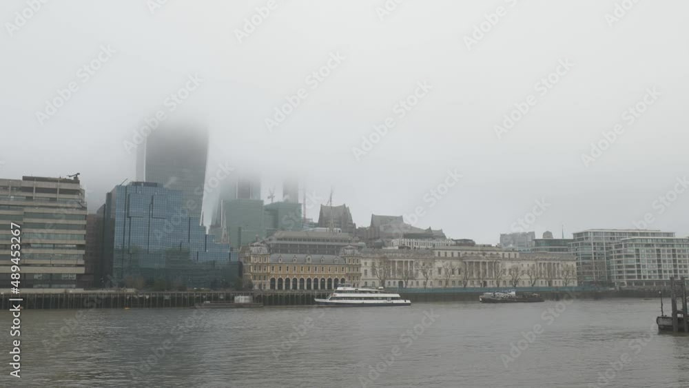Top of buildings hidden in the fog on the Thames riverside. Top of buildings hidden in the fog on the Thames riverside.