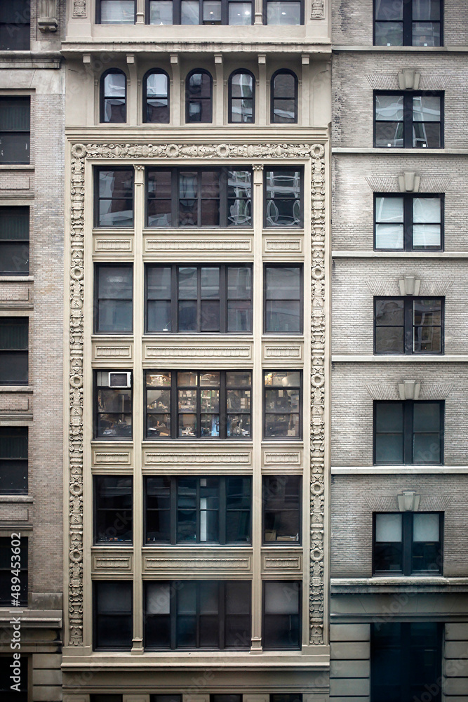 Downtown building with windows and decoration Downtown building with windows and decoration