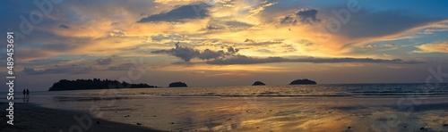 Panorama of spectacular sunset on deserted beach with bright colors and no people with palm trees on Koh Chang Island  Thailand.