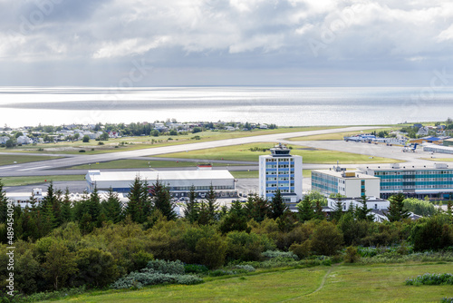 Fotografie View of a small domestic airport near the coast on a cloudy summer day