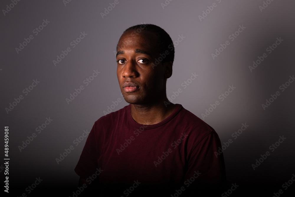 Portrait of a serious and thoughtful boy in a dark environment Portrait of a serious and thoughtful boy in a dark environment