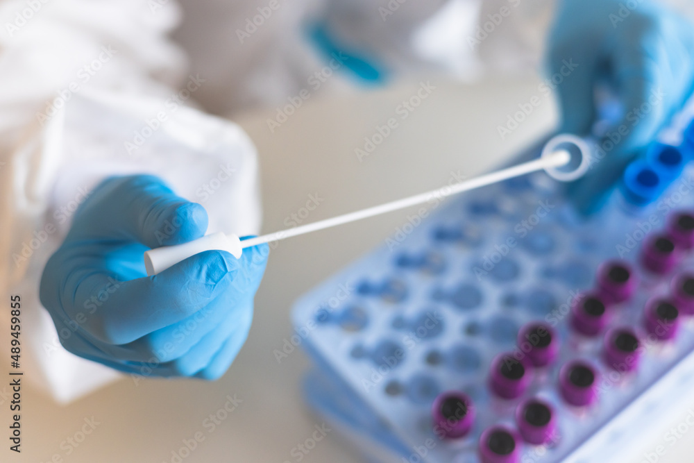 Process of coronavirus PCR antigen testing examination by nurse medic in laboratory lab, COVID-19 swab collection kit, test tube for taking OP NP patient specimen sample, patient receiving test Process of coronavirus PCR antigen testing examination by nurse medic in laboratory lab, COVID-19 swab collection kit, test tube for taking OP NP patient specimen sample, patient receiving test
