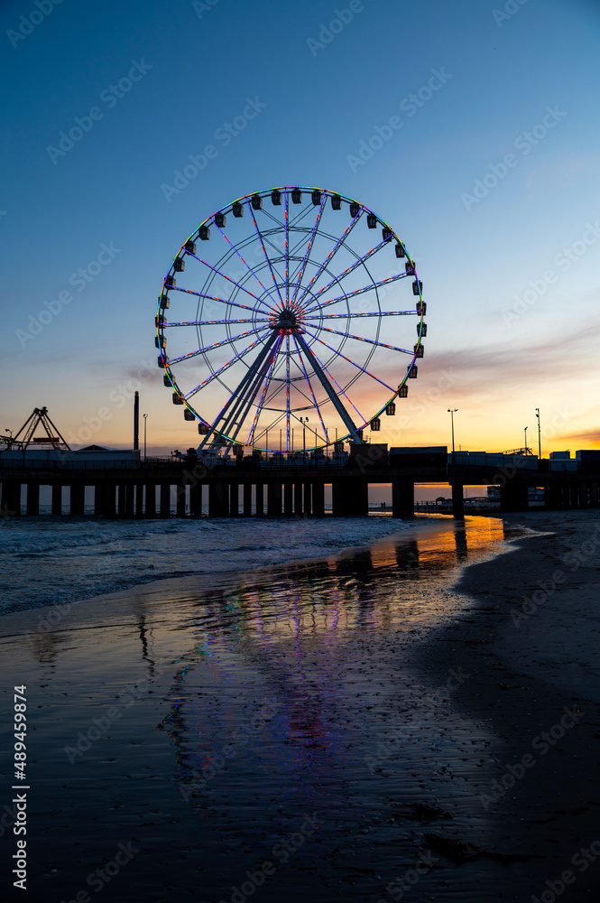 Ferris wheel on the pier sunset