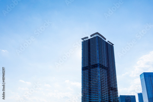 Tower apartments lined up along the river and a refreshing blue sky_33
