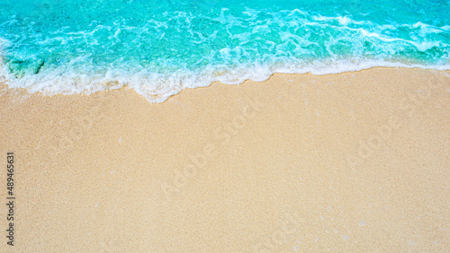 Fototapeta Naklejka Na Ścianę i Meble -  Summer beach background / sea wave on the sand for a space for you to enter text..