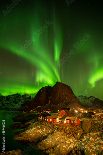 Northern lights over the Hamnoy village at night in winter season, Lofoten islands, Norway, Europe