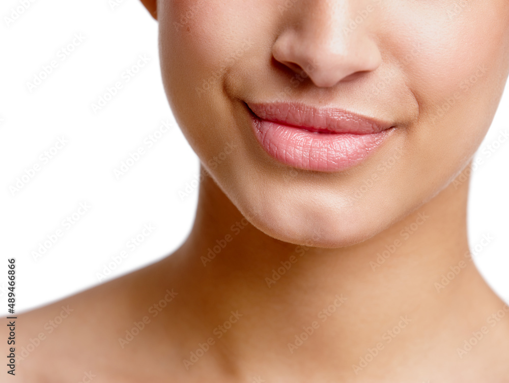 Obraz premium Her smile can charm anyone. Closeup studio shot of a beautiful young womans mouth.