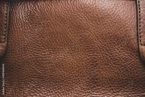 Genuine leather texture background. Dark brown, orange textures for decoration blank. Vintage skin natural suede.