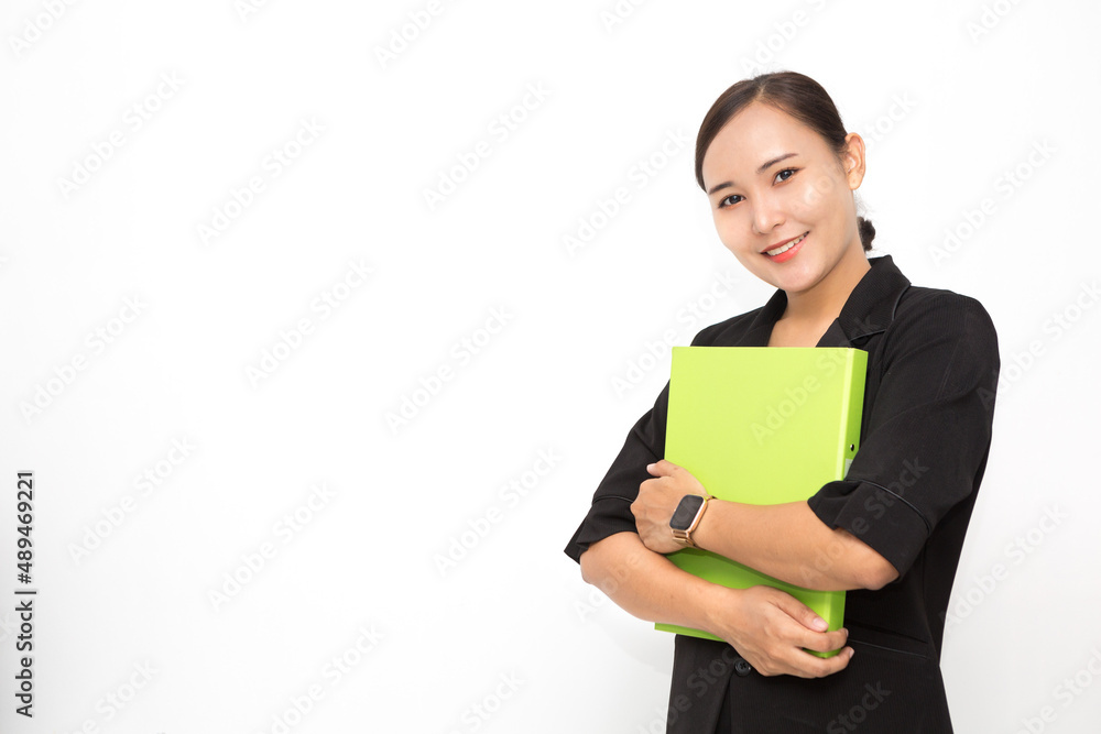 Beautiful Asian business woman wearing black suit holding document folder smiling on white background and copy space. Confident Asian working woman smiling and cheerful Beautiful Asian business woman wearing black suit holding document folder smiling on white background and copy space. Confident Asian working woman smiling and cheerful