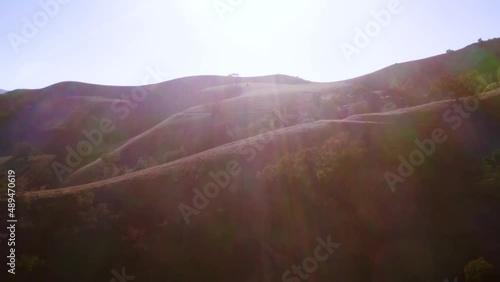 Beautiful outdoor ranch landscapes, shots of a overlanding Toyota 4Runner with a rooftop tent on an off road adventure, vast golden mountain tops with long views of valleys and oak trees and incredibl