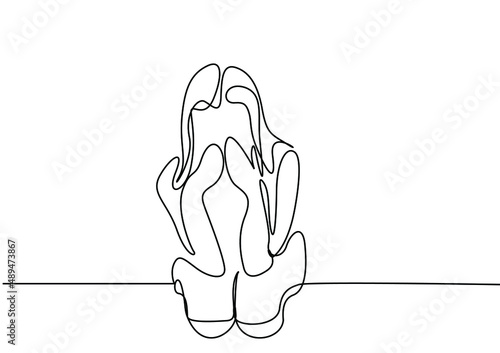 sad young beautiful woman sitting and crying